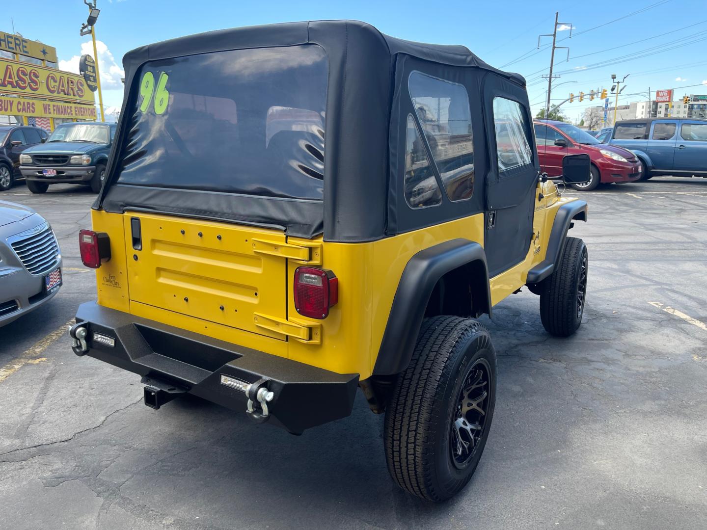 2000 Solar Yellow /Black Jeep Wrangler SE (1J4FA29P9YP) with an 2.5L 4 Cyl. engine, Manual transmission, located at 801 South State Street, Salt Lake City, UT, 84111, (801) 328-0098, 40.751953, -111.888206 - Wow extremely rare to find extra clean Jeep in immaculate condition 4x4! Low miles only 98,248 miles! Interior and exterior are both in excellent shape for the year. This is a clean title no reported accidents on the CarFax history report. It has passed emissions already and is ready to go. Featur - Photo#14